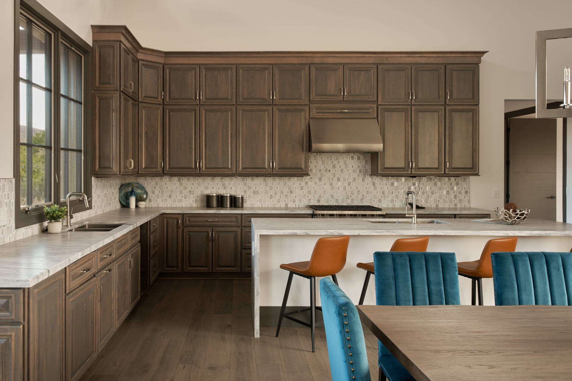 Kitchen with dark cabinets and stone island